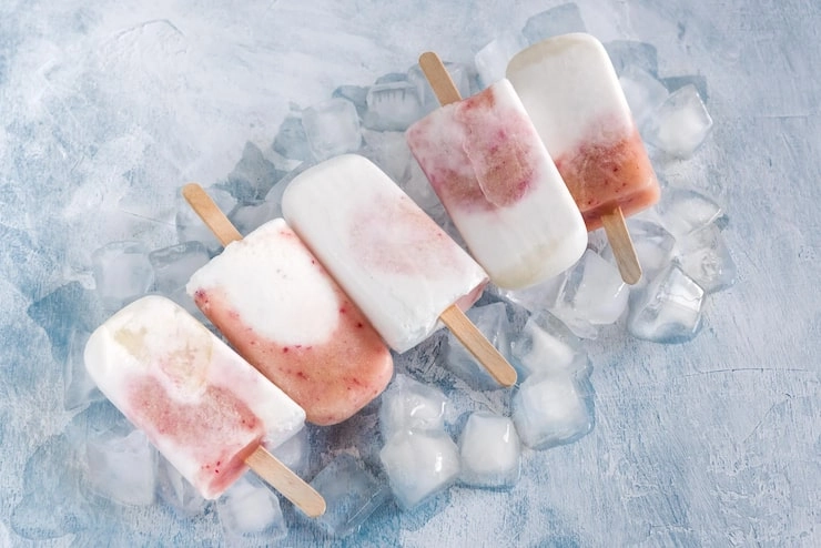 The Cold Hard Facts: Can Mold Really Grow on Your Frozen Ice Cream?插图 Four swirled strawberry-and-cream popsicles on wooden sticks
